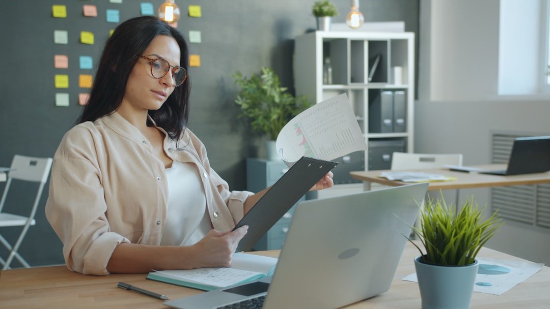 reviewing investment charts on a laptop