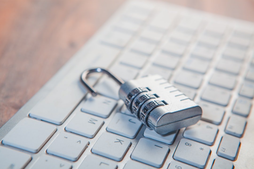 a padlock resting on a laptop keyboard, representing free password manager security
