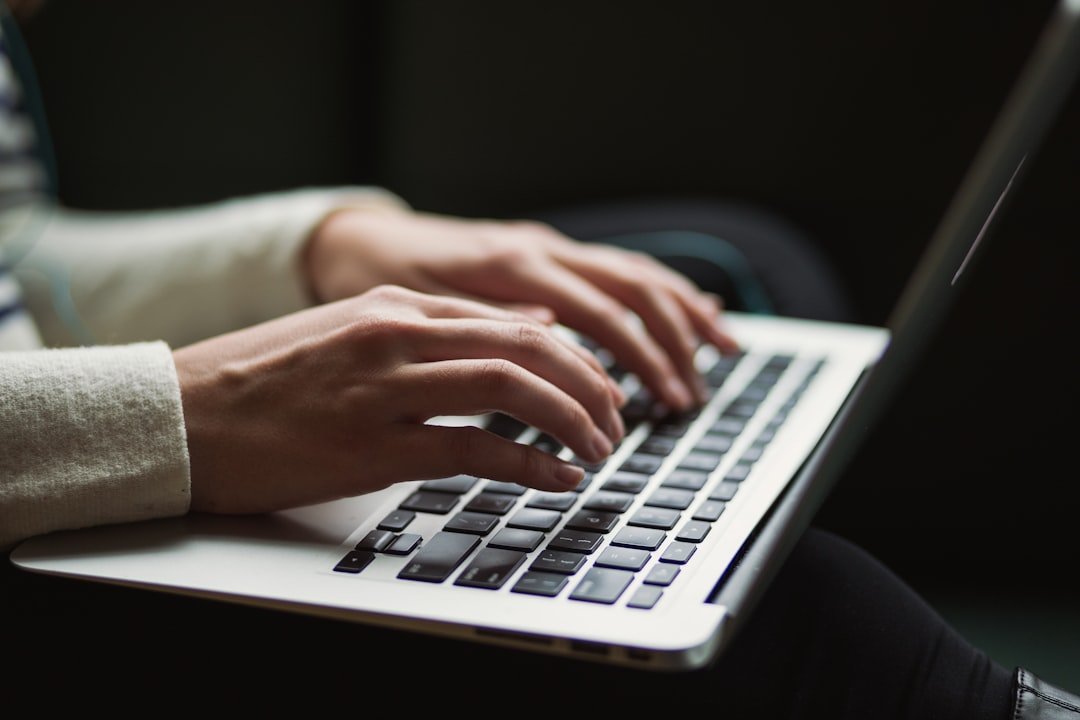 reviewing a document on a laptop