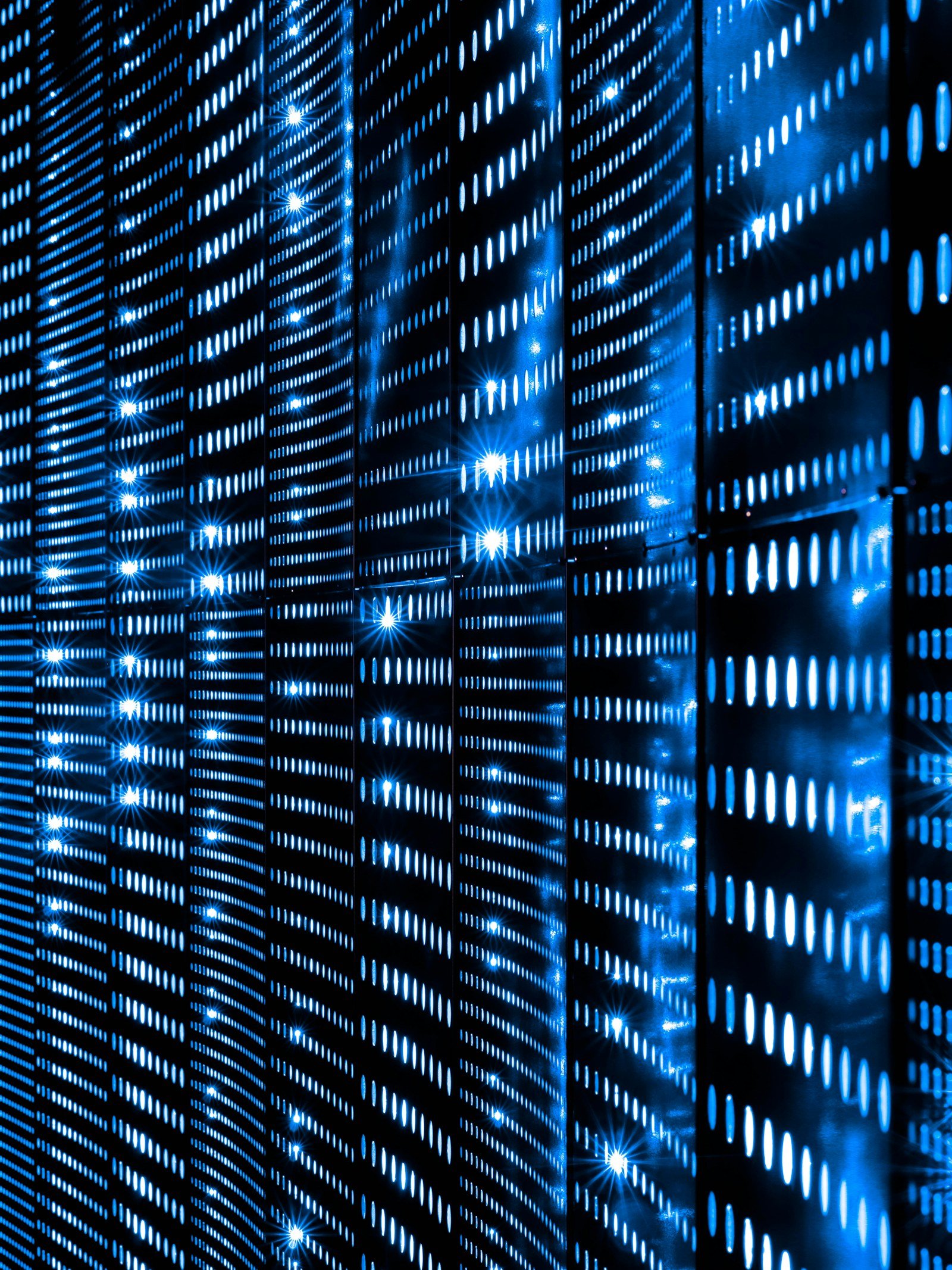 rows of blue server indicator lights in a data centre
