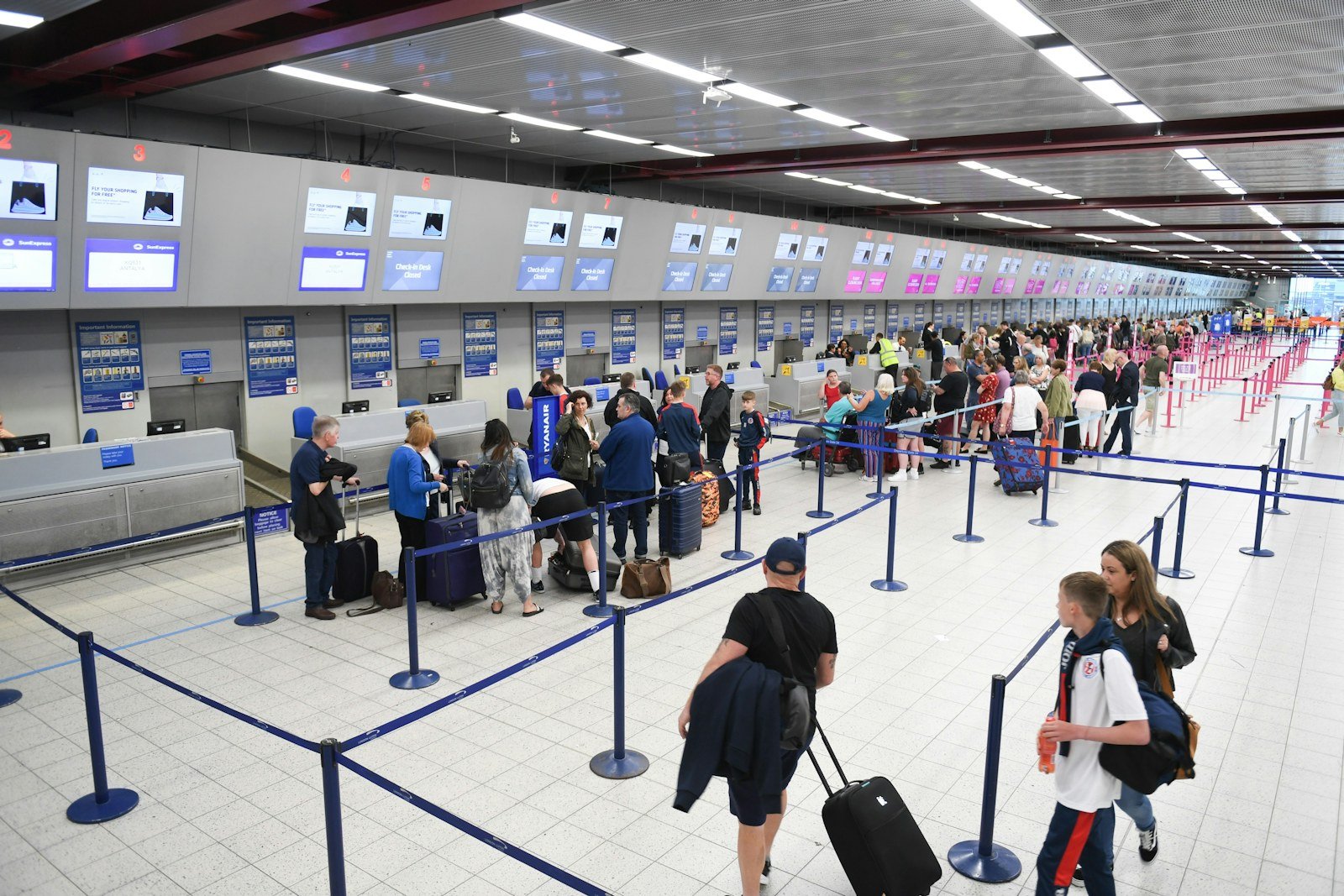 people waiting in an airport terminal