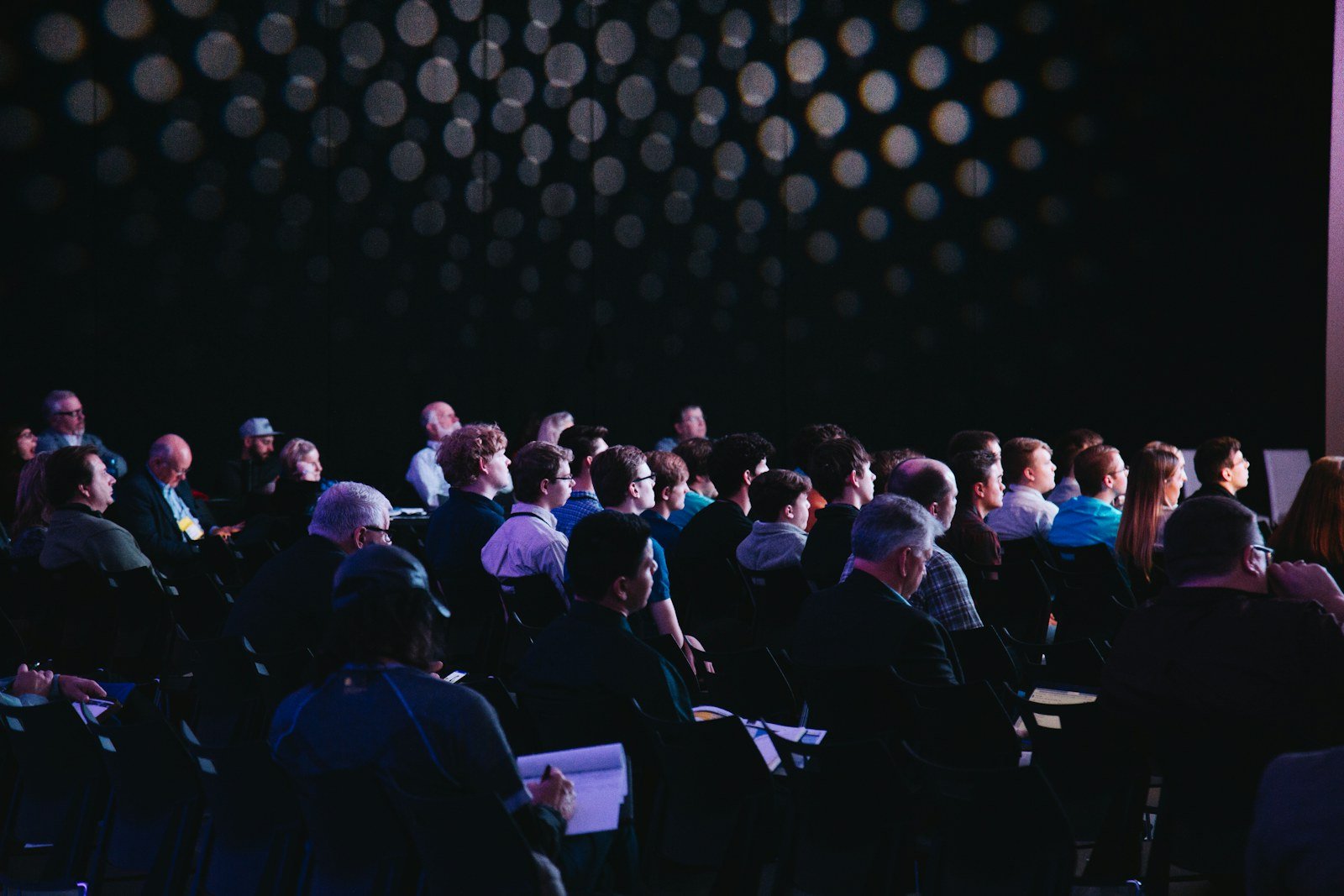 an audience seated at a technology conference